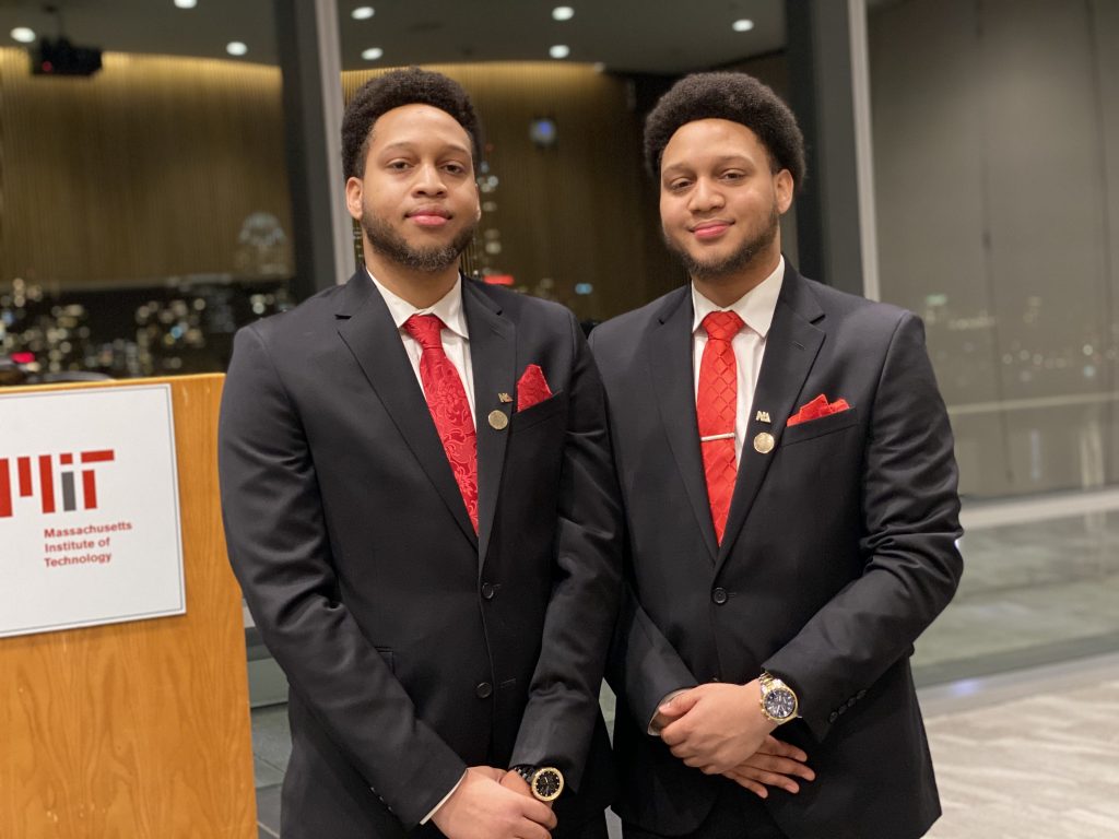 Two men in suits next to each other