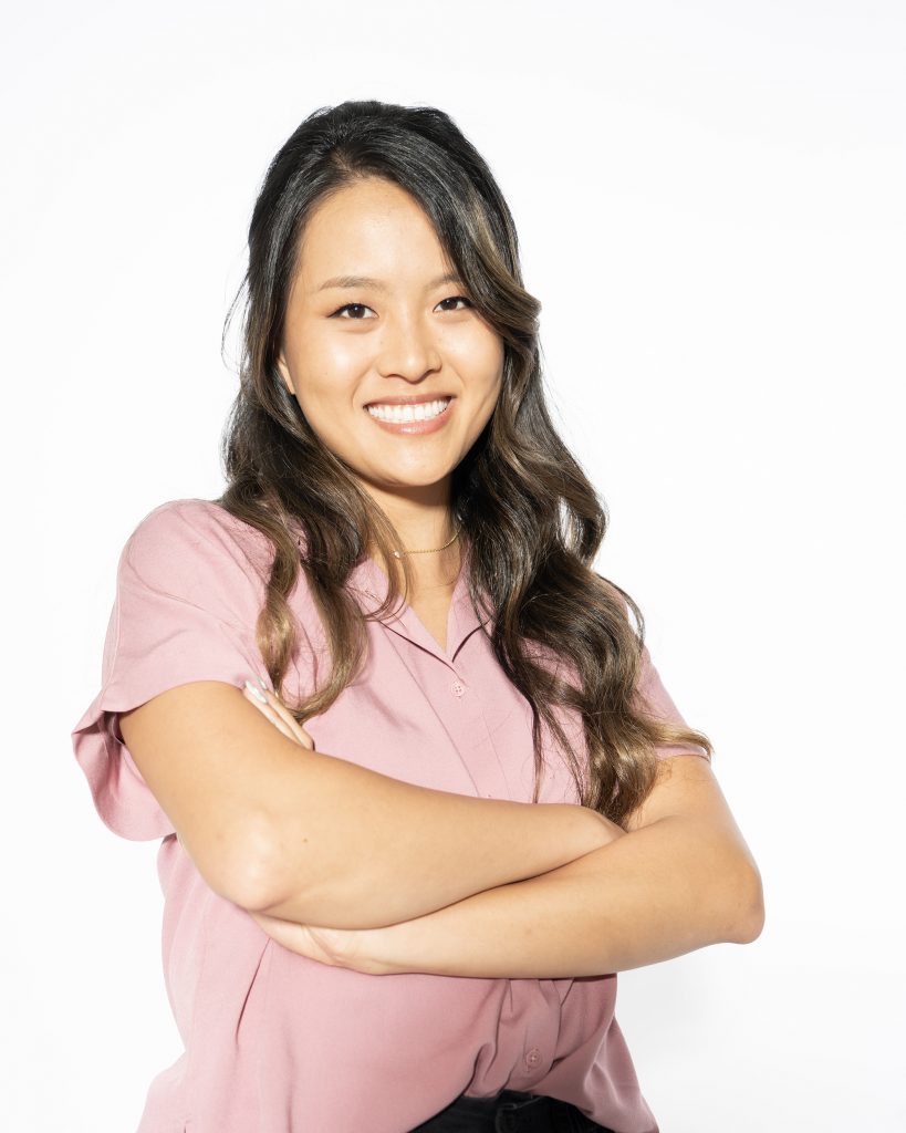 Dorothy Feng standing with her arms crossed