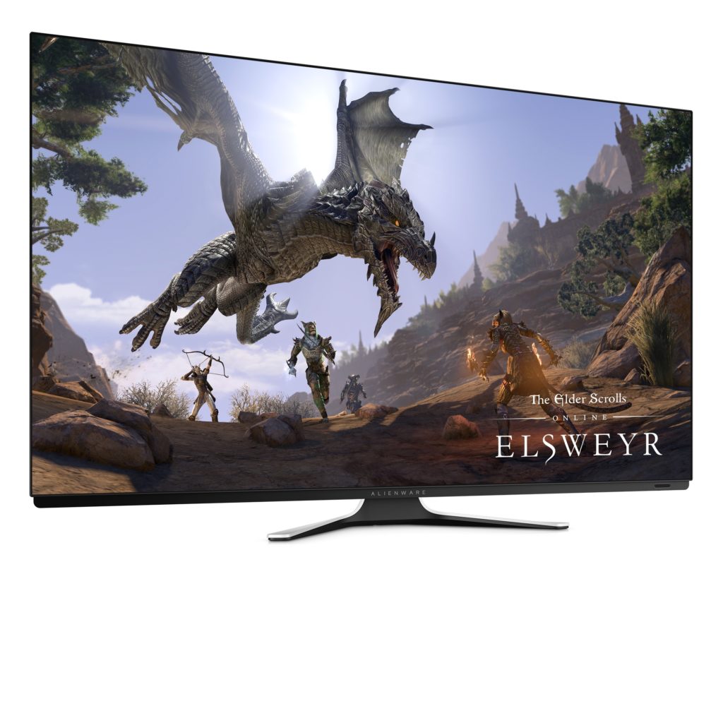 Photo of the Alienware 55 OLED Gaming Monitor wit The Elder Scrolls on its screen with a dragon bearing down on players