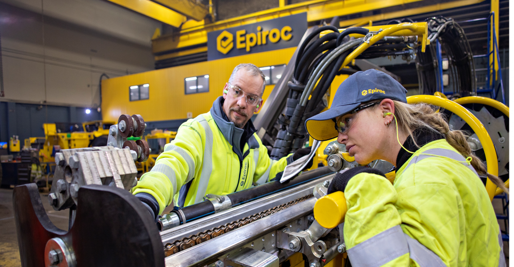 Two workers in manufacturing plant