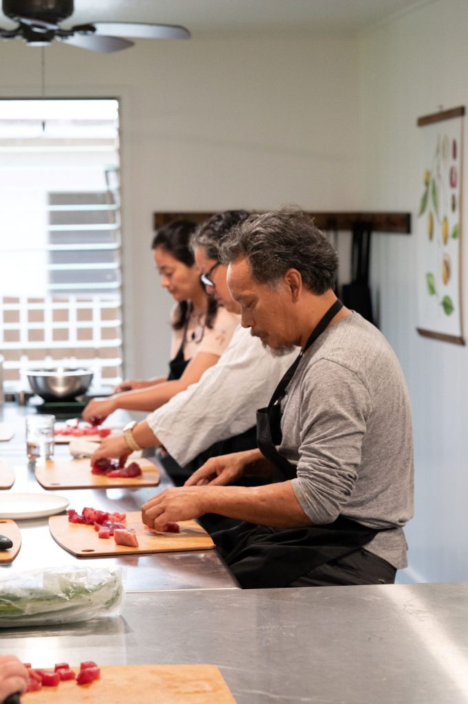 Students making spam musubi