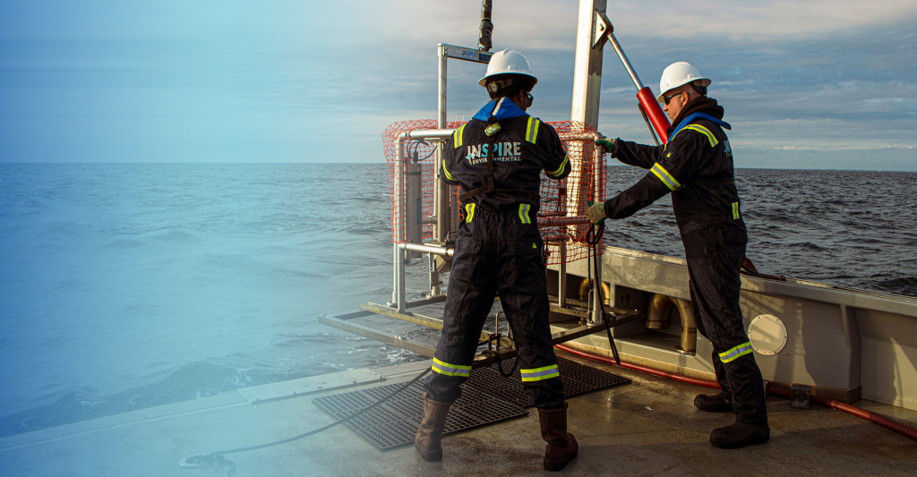 Two workers on ocean platform