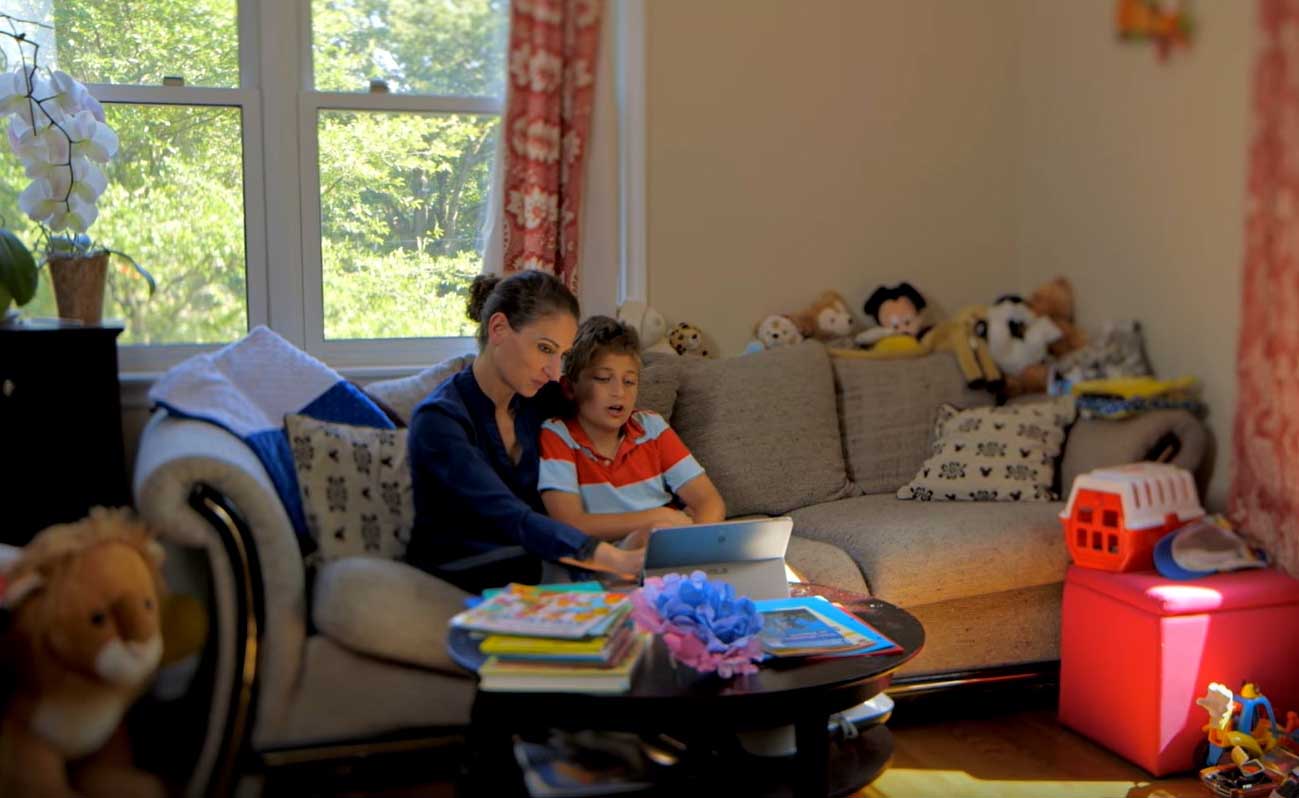 Mitra Niknam and her son with a Windows 10 device 