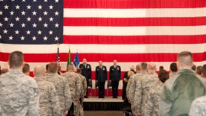 Soldiers with flag in background