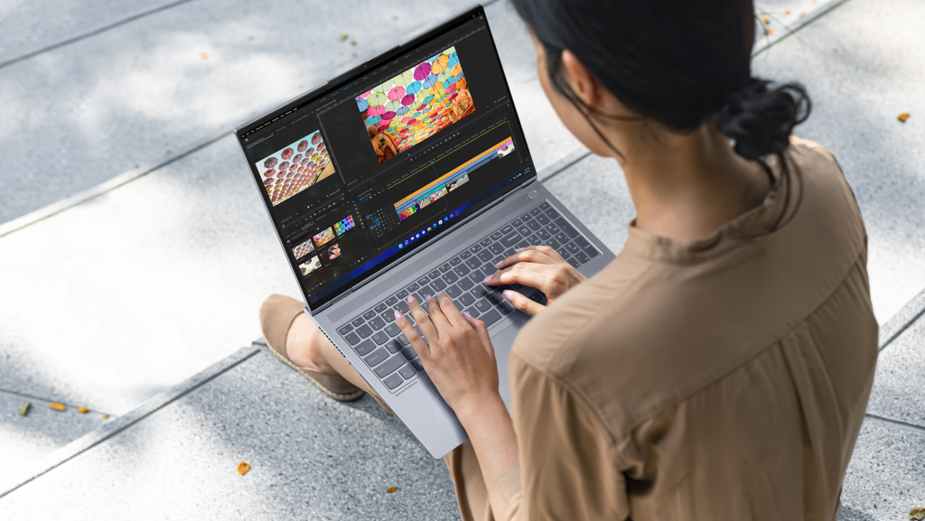 Woman editing an image on a ThinkBook 16p Gen 3 laptop